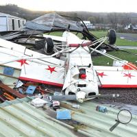 A high-wing airplane was tossed by the heavy winds that blew through the Benton area early Monday morning. The damaging winds tore apart the hangar for the plane, along with the Benton Borough maintenance shed at the airport.