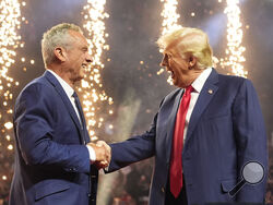 Republican presidential candidate Donald Trump introduces Robert F. Kennedy Jr. at a reelection campaign rally in Glendale, Arizona, on Aug. 23, 2024.