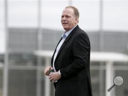  In this Feb. 25, 2015, file photo, baseball broadcast analyst and former Boston Red Sox pitcher Curt Schilling watches as the Red Sox workout at baseball spring training in Fort Myers, Fla. (AP Photo/Tony Gutierrez, File)