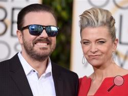 Ricky Gervais, left, and Jane Fallon arrive at the 73rd annual Golden Globe Awards on Sunday, Jan. 10, 2016, at the Beverly Hilton Hotel in Beverly Hills, Calif. (Photo by Jordan Strauss/Invision/AP)