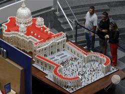 In this Friday, Sept. 11, 2015 photo, shown is a Lego representation of the St. Peter’s basilica and square, at The Franklin Institute in Philadelphia. The Rev. Bob Simon spent about 10 months building it with approximately half-a-million Legos. (AP Photo/Matt Rourke)