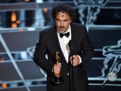 Alejandro G. Inarritu accepts the award for best director for “Birdman or (The Unexpected Virtue of Ignorance)” at the Oscars on Sunday, Feb. 22, 2015, at the Dolby Theatre in Los Angeles. (Photo by John Shearer/Invision/AP)