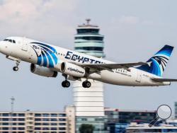 This August 21, 2015 photo shows an EgyptAir Airbus A320 with the registration SU-GCC taking off from Vienna International Airport, Austria. Egyptian aviation officials said on Thursday May 19, 2016 that an EgyptAir plane with the registration SU-GCC, traveling from Paris to Cairo with 66 passengers and crew on board has crashed off the Greek island of Karpathos. (AP Photo/Thomas Ranner)