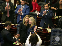 State Reps. Jennifer Canady, left, and Jenna Persons-Mulicka embrace after the Republican-dominated Legislature on approved a ban on abortions after six weeks of pregnancy, Thursday, April 13, 2023, in Tallahassee, Fla. (Alicia Devine/Tallahassee Democrat via AP)