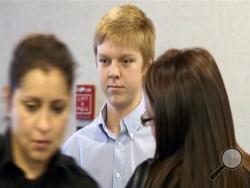 In this December 2013 image taken from a video by KDFW-FOX 4, Ethan Couch is seen during his court hearing in Fort Worth, Texas. Long before Ethan Couch and his family became notorious for using an “affluenza” defense in his deadly drunken driving crash, they had multiple run-ins with the law, each time flouting authority or relying on their wealth to get them out of trouble. (AP Photo/KDFW-FOX 4, File)