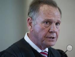 Roy Moore, Chief Justice of the Alabama Supreme Court, speaks during a news conference at the Judicial Building in Montgomery, Ala., Wednesday, April 27, 2016. Moore says a judicial ethics panel should dismiss complaints filed against him as he fought to keep gays and lesbians from marrying in the state. (Mickey Welsh/Montgomery Advertiser via AP)