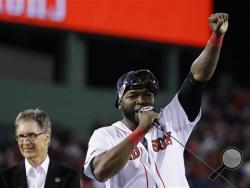 Boston Red Sox designated hitter David Ortiz, right, addresses the crowd alongside team owner John Henry, left, after the Red Sox beat the Detroit Tigers 5-2 in Game 6 of the American League baseball championship series. (AP Photo)