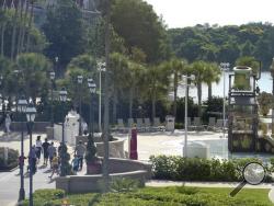 Hotel guests are directed away from the closed pool and beach area as law enforcement officials search the Seven Seas Lagoon outside the Grand Floridian Resort & Spa on Wednesday, June 15, 2016, in Lake Buena Vista, Fla., after a two-year-old toddler was dragged into the lake by an alligator. (AP Photo/Phelan M. Ebenhack)