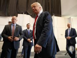 Republican presidential candidate Donald Trump walks away after speaking to reporters before a town hall event, Monday, Aug. 1, 2016, in Columbus, Ohio . (AP Photo/Evan Vucci)