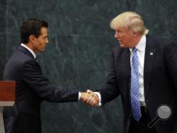 Mexico President Enrique Pena Nieto and Republican presidential nominee Donald Trump shake hands after a joint statement at Los Pinos, the presidential official residence, in Mexico City, Wednesday, Aug. 31, 2016. Trump is calling his surprise visit to Mexico City Wednesday a 'great honor.' The Republican presidential nominee said after meeting with Pena Nieto that the pair had a substantive, direct and constructive exchange of ideas.(AP Photo/Dario Lopez-Mills)
