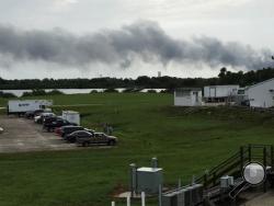 Smoke rises from a SpaceX launch site Thursday, Sept. 1, 2016, at Cape Canaveral, Fla. NASA said SpaceX was conducting a test firing of its unmanned rocket when a blast occurred. (AP Photo/Marcia Dunn)