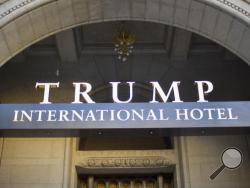 FILE - This Monday, Sept. 12, 2016, file photo, shows the exterior of the Trump International Hotel in downtown Washington. Donald Trump’s unusual status as incoming president and owner of a Washington hotel is drawing renewed attention as one of the Middle East’s richest kingdoms plans to host its National Day celebration at the venue. Salem Al-Sabah, Kuwait’s ambassador to the U.S., says the party is scheduled for Feb. 25 at the “new hotel in town.” (AP Photo/Pablo Martinez Monsivais)