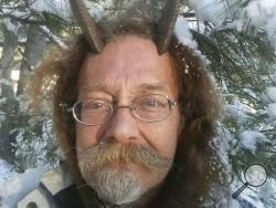 This Dec. 7, 2016, photo provided by Phelan Moonsong shows a portrait of himself in Portland, Maine. Moonsong, an ordained Pagan priest, finally has gotten the OK to sport goat horns in his Maine driver's license photo. Maine resident Moonsong said that unless he's sleeping or bathing, he always wears his goat horns, which serve as his spiritual antennae and help him educate others about Paganism. (Phelan Moonsong via AP)