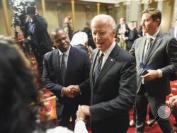 Vice President Joe Biden leaves the Old Senate Chamber following a mock swearing in ceremony on Capitol Hill in Washington, Tuesday, Jan. 3, 2017, as the 115th Congress begins. (AP Photo/Kevin Wolf)