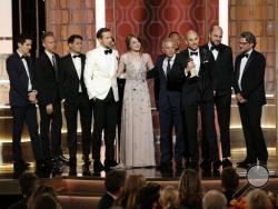 This image released by NBC shows the cast and crew of "La La Land" winner of the award for best motion picture musical or comedy at the 74th Annual Golden Globe Awards at the Beverly Hilton Hotel in Beverly Hills, Calif., on Sunday, Jan. 8, 2017. (Paul Drinkwater/NBC via AP)
