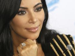 FILE - In this June 24, 2015 file photo, American TV personality Kim Kardashian attends the Cannes Lions 2015, International Advertising Festival in Cannes, southern France. Paris police Monday Jan.9, 2017 say 16 people have been arrested over Kim Kardashian jewelry heist. (AP Photo/Lionel Cironneau, File)
