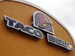 FILE - This Friday, May 23, 2014, file photo, shows the sign at a Taco Bell in Mount Lebanon, Pa. Taco Bell announced plans on Jan. 11, 2017, to go nationwide with its Naked Chicken Chalupa, a taco with a shell made out of fried chicken. (AP Photo/Gene J. Puskar, File)