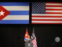 FILE - In this March 22, 2016 file photo, President Barack Obama speaks at the Grand Theater of Havana, Cuba. President Barack Obama is ending a longstanding immigration policy that allows any Cuban national who makes it to U.S. soil to stay and become a legal resident, a senior administration official said Thursday, Jan. 12, 2017. (AP Photo/Desmond Boylan, File)