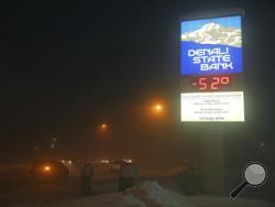The Denali State Bank sign along Chena Pump Road in Fairbanks, Alaska, reflects the frigid temperatures that have enveloped the interior of the state Wednesday, Jan. 18, 2017. (Eric Engman/Fairbanks Daily News-Miner via AP)