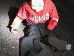 This Sunday, Jan. 22, 2017 photo provided by Carteret County Sheriff’s Office in North Carolina shows a dummy constructed of a fake plastic head and children’s clothing that was left in the road in the county’s Paradise East subdivision. A sheriff’s statement said a woman narrowly escaped being carjacked by multiple men who pulled on her door handles after she slowed down for the dummy that she thought was a child in the road. (Carteret County Sheriffs Office via AP)