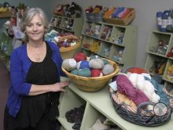 Elizabeth Poe poses in her store, The Joy of Knitting, Wed., Jan. 25, 2017, in Franklin, Tenn. Poe asked that customers go elsewhere if they want knitting supplies for the recent women's marches in which many participants wore knitted pink hats. Poe made a social media post saying the "vulgarity, vile and evilness" of the women's movement is "absolutely despicable." She framed her comments around Saturday's massive women's march in Washington. (Shelley Mays/The Tennessean via AP)