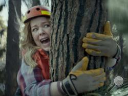 This photo provided by Kia Motors America shows a scene from the company's spot for Super Bowl 51, between the New England Patriots and Atlanta Falcons, Sunday, Feb. 5, 2017. Melissa McCarthy humorously takes on political causes like saving whales, ice caps and trees, each time to disastrous effect, in Kia’s 60-second third-quarter ad to promote the fuel efficiency of its 2017 Niro crossover. (Kia Motors America via AP)