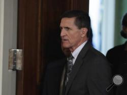 FILE- In this Feb. 13, 2017, file photo, National Security Adviser Michael Flynn in the east Room of the White House in Washington for a joint news conference with President Donald Trump and Canadian Prime Minister Justin Trudeau. Flynn resigned as Trump's national security adviser Monday. (AP Photo/Evan Vucci, File)