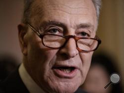 In this Feb. 14, 2017, photo, Senate Minority Leader Charles Schumer of N.Y, speaks to reporters on Capitol Hill in Washington. Beneath the capital’s radar looms a catchall spending package that’s likely to top $1 trillion. It could get embroiled in the politics of building Trump’s wall at the U.S.-Mexico border and a budget-busting Pentagon request. (AP Photo/J. Scott Applewhite)