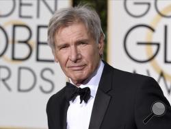 FILE - In this Jan. 10, 2016 file photo, Harrison Ford arrives at the 73rd annual Golden Globe Awards in Beverly Hills, Calif. NBC-TV says Ford had a potentially serious run-in with an airliner at a Southern California airport. NBC reports that Ford, an experienced pilot, was told to land on a runway at John Wayne Airport in Orange County on Monday, Feb. 13, 2017, but mistakenly landed on a parallel taxiway, passing over an American Airlines jet holding nearby. (Photo by Jordan Strauss/Invision/AP, File)