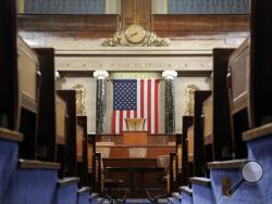 FILE - This Dec. 8, 2008, file photo shows the House Chamber on Capitol Hill in Washington. A presidential speech to Congress is one of those all-American moments that ooze ritual and decorum. The House sergeant-at-arms will stand at the rear of the House of Representatives on Tuesday night and announce the arrival of Donald Trump before a joint session of Congress by intoning: “Mister Speaker, the President of the United States” just like always. (AP Photo/Susan Walsh, File)