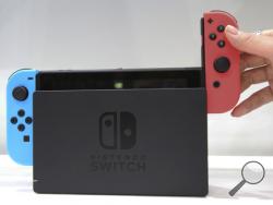 In this Friday, Jan. 13, 2017, file photo, a model puts the controller onto the Nintendo Switch during a presentation event of the new Nintendo Switch in Tokyo. Nintendo’s new Switch device aims at video gamers who like to play both at home and on the road. It’s an impressive device, notwithstanding trade-offs in appealing to both. The bigger question is whether Nintendo will be able to deliver enough games to keep Switch users happy. (AP Photo/Koji Sasahara, File)