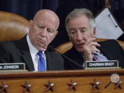 House Ways and Means Committee Chairman Rep. Kevin Brady, R-Texas, left, listens to the committee's ranking member, Rep. Richard Neal, D-Mass., on Capitol Hill in Washington, Wednesday, March 8, 2017, as the committee began markup of the long-awaited plan by Republicans to repeal and replace the Affordable Care Act. (AP Photo/J. Scott Applewhite)