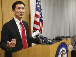 Hawaii Attorney General Douglas Chin speaks at a news conference Thursday, March 9, 2107, in Honolulu. Chin's office filed an amended lawsuit against President Donald Trump's revised travel ban. (AP Photo/Marco Garcia)