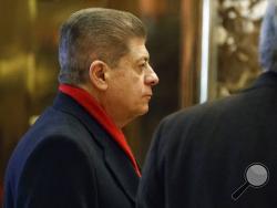 FILE- In this Dec. 15, 2016, file photo, Judge Andrew Napolitano waits for an elevator in the lobby of Trump Tower in New York. Fox News Channel has pulled legal analyst Napolitano from the air after disavowing his on-air claim that British intelligence officials had helped former President Barack Obama spy on Donald Trump. The move was first reported by The Los Angeles Times on Monday, March 20, 2017. (AP Photo/Evan Vucci, File)