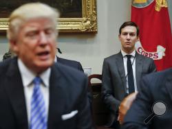 FILE - In this Monday, Jan. 23, 2017, file photo, White House Senior Adviser Jared Kushner, right, listens to President Donald Trump speak during a breakfast with business leaders in the Roosevelt Room of the White House in Washington. Trump is set to announce a new White House office run by his son-in-law, Kushner, that will seek to overhaul government functions using ideas from the business sector. (AP Photo/Pablo Martinez Monsivais, File)