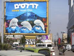 A poster for the Smurfs, The Lost Village, movie is seen in the central Israeli city of Bnei Brak. Tuesday, March, 28, 2017. The PR firm promoting “Smurfs: The Lost Village” says it removed Smurfette from promo posters in central city of Bnei Brak so as not to offend its ultra-Orthodox Jewish residents. The deeply conservative ultra-Orthodox chafe at the public display of women’s images. (AP Photo/Sebastian Scheiner)