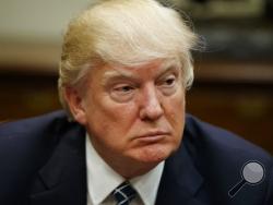 FILE - In this Tuesday, March 28, 2017, file photo, President Donald Trump listens during a meeting with the Fraternal Order of Police, in the Roosevelt Room of the White House in Washington. Trump says that the United States is prepared to act alone if China does not take a tougher stand against North Korea’s nuclear program. (AP Photo/Evan Vucci, File)