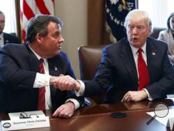 President Donald Trump shakes hands with New Jersey Gov. Chris Christie during an opioid and drug abuse listening sessionWednesday, March 29, 2017, in the Cabinet Room of the White House in Washington. (AP Photo/Evan Vucci)