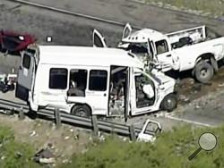 This aerial image made from a video provided by KABB/WOAI shows a deadly crash involving a van carrying church members and a pickup truck on U.S. 83 outside Garner State Park in northern Uvalde County, Texas, Wednesday, March 29, 2017. The group of senior adults from First Baptist Church of New Braunfels, Texas, was returning from a retreat when the crash occurred, a church statement said. (KABB/WOAI via AP) 