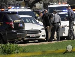 Pennsylvania State Police look over a car as they investigate the scene where Steve Stephens, the suspect in the random killing of a Cleveland retiree posted on Facebook, was found shot dead Tuesday, April 18, 2017, in Erie. Pa. Acting on a tip, Pennsylvania State Police spotted Stephens, 37, in Erie County, in the state's northwest corner, and went after him. After a brief chase, he took his own life, authorities said.(Greg Wohlford/Erie Times-News via AP)