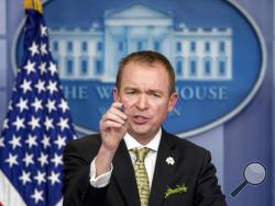 FILE - In this March 16, 2017, file photo, White House budget director Mick Mulvaney speaks at the White House, in Washington. Mulvaney says that Democratic negotiators on a massive spending bill need to agree to funding top priorities of President Donald Trump, such as a down payment on a border wall and hiring of additional immigration agents. Mulvaney told The Associated Press on April 20, that “elections have consequences” and that “we want wall funding” as part of the catchall spending bill, which lawm