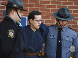 FILE - In this Jan. 5, 2015, file photo, Eric Frein is led away by Pennsylvania State Police Troopers at the Pike County Courthouse after his preliminary hearing in Milford, Pa. Prosecutors are seeking the death penalty against Frein, who they said targeted state police because he was trying to foment an uprising against the government. Frein’s lawyers want the jury to sentence him to life without parole. (Butch Comegys/The Times & Tribune via AP, File)