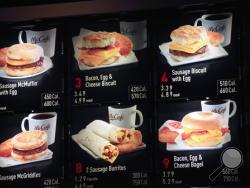FILE - In this Sept. 12, 2012 file photo, items on the breakfast menu, including the calories, are posted at a McDonald's restaurant in New York. Facing a May 5, 2017 compliance deadline set by the Food and Drug Administration last year, some restaurants and other establishments are eyeing a massive spending bill that Congress will have to pass in the next week to keep the government open and hope to either delay the menu labeling rules again or include legislation in the larger bill that would revise the l