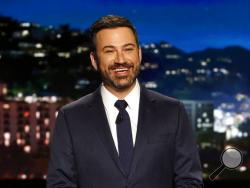 FILE - In this April 11, 2017 file photo, host Jimmy Kimmel appears during a taping of "Jimmy Kimmel Live," in Los Angeles. Kimmel zinged his critics as he returned to late-night TV and resumed arguing that Americans deserve the level of health care given his infant son. Back on ABC's "Jimmy Kimmel Live" Monday, May 8, after a week's absence, he said baby Billy is recovering well from open-heart surgery for a birth defect and thanked well-wishers. Then he charged back into the fraught topic. (Randy Holmes/A