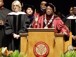 Bethune-Cookman University president Edison Jackson, right, appeals to protesters disrupting Education Secretary Betsy DeVos' speech during commencement exercises, Wednesday, May 10, 2017, in Daytona Beach, Fla. (AP Photo/John Raoux)