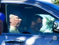 Republican candidate for Montana's only U.S. House seat, Greg Gianforte, sits in a vehicle near a Discovery Drive building Wednesday, May 24, 2017, in Bozeman, Mont. A reporter said Gianforte "body-slammed" him Wednesday, the day before the special election. (Freddy Monares/Bozeman Daily Chronicle via AP)