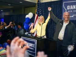  Greg Gianforte, right, and wife Susan, center, celebrate his win over Rob Quist for the open congressional seat at the Hilton Garden Inn Thursday night, May 25, 2017, in Bozeman, Mont. Gianforte, a technology entrepreneur, defeated Democrat Quist to continue the GOP's two-decade stronghold on the congressional seat. (Rachel Leathe/Bozeman Daily Chronicle via AP)