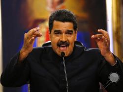 FILE - In this June 22, 2017 file photo, Venezuela's President Nicolas Maduro gives a news conference in Caracas, Venezuela. Maduro said a helicopter fired on Venezuela's Supreme Court in a confusing incident that he claimed was part of a conspiracy to destabilize his socialist government, on Tuesday, June 27, 2017. (AP Photo/Ariana Cubillos, File)