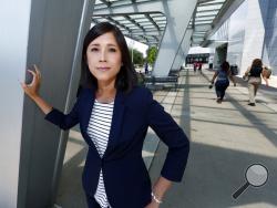 Noi Liang, an intersex woman who works part-time as a patient advocate at Children's Hospital Colorado, stands for a photo at the medical center in the Denver suburb of Aurora, Colo., on Friday, July 7, 2017. Liang, who works for a technology firm, says the parents considering surgery for very young intersex children tend to be thorough and thoughtful in their deliberations, hoping that the decisions they make will be the ones that their children _ looking back years from now as adults _ would have wanted t