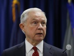 FILE - In this July 21, 2017 file photo, Attorney General Jeff Sessions speaks in Philadelphia. President Donald Trump took a new swipe at on Monday, July 24, 2017, referring to him in a tweet as “beleaguered” and wondering why Sessions isn’t digging into Hillary Clinton’s alleged contacts with Russia. (AP Photo/Matt Rourke, File)